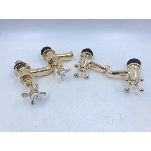 705A - Four pairs of various brass effect taps to include Waterworks etc.