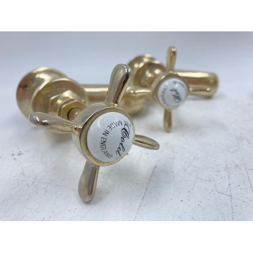 705A - Four pairs of various brass effect taps to include Waterworks etc.