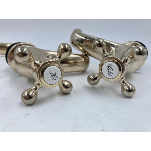 705A - Four pairs of various brass effect taps to include Waterworks etc.