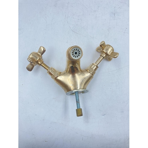 705A - Four pairs of various brass effect taps to include Waterworks etc.