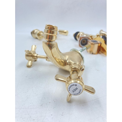 705A - Four pairs of various brass effect taps to include Waterworks etc.