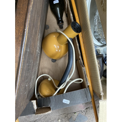 748 - Four boxes containing glass paperweights, antique flat irons, glass bowl, tray, metal detector, lawn... 