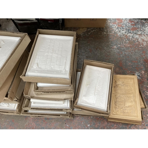 753 - A large quantity of chalkware wall plaques to include Bossons Ivorex hand painted Lincoln Cathedral,... 