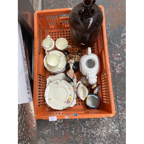 755 - A collection of items to include brown glass demijohn, ceramics, Workzone insulation wrap, boxed rad... 