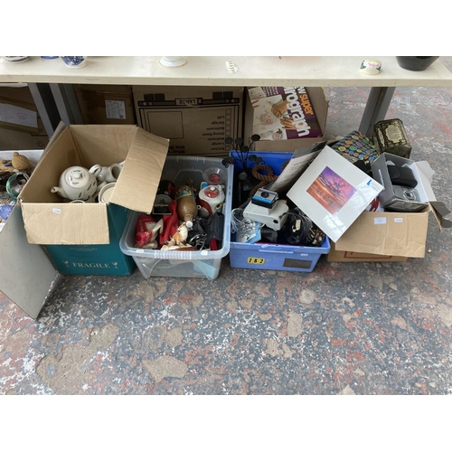 774 - Four boxes containing Halina 35mm compact camera, dog ornaments, tin opener, Polaroid Swinger II lan... 