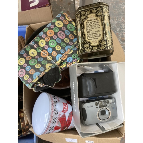 774 - Four boxes containing Halina 35mm compact camera, dog ornaments, tin opener, Polaroid Swinger II lan... 