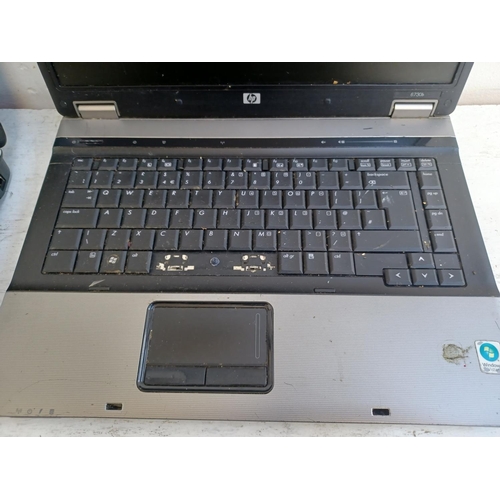 583 - Four laptops, one Lenovo ThinkPad Windows XP Professional with power supply, two HP (A/F) and one Ac... 