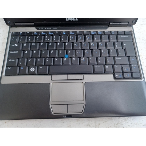 585 - Two items, one Simbans Tango Tab and one Dell PP09S Latitude D430 Windows Vista Business notebook