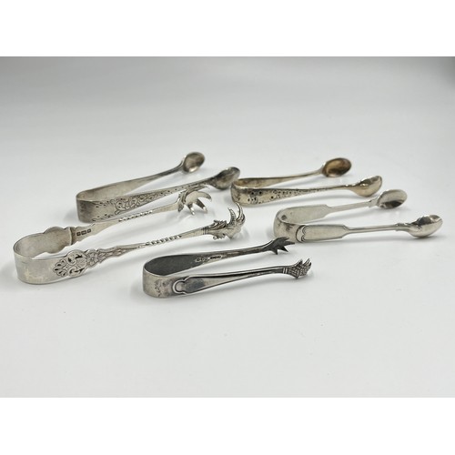 1234 - Five antique hallmarked sterling silver sugar tongs to include Edwardian Sheffield silver with claw ... 