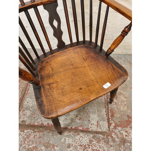 296 - A 19th century elm Windsor armchair - approx. 107cm high x 54cm wide x 39cm deep