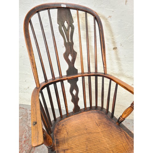 296 - A 19th century elm Windsor armchair - approx. 107cm high x 54cm wide x 39cm deep