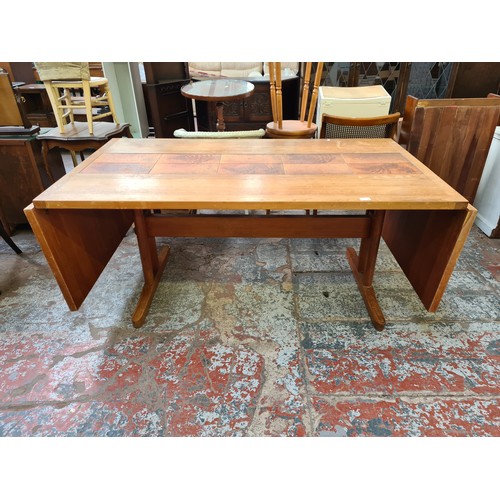 382 - A Danish 'AM' teak and tiled top rectangular dining table and six matching chairs - approx. 73cm hig... 