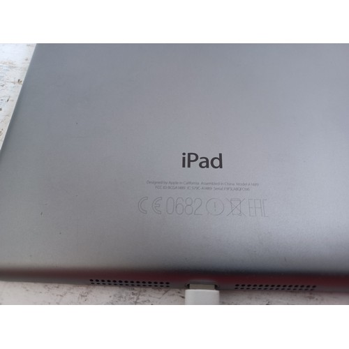 584 - An Apple A1489 iPad Mini with charger and case