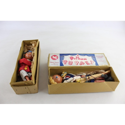 144 - Two boxed vintage Pelham Marionette puppets, one school boy and one school girl