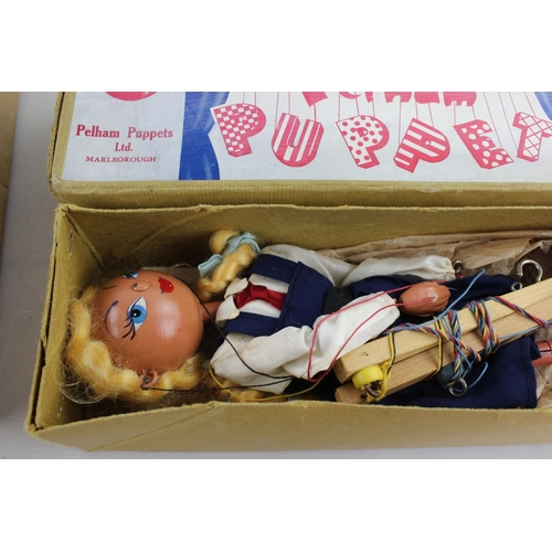 144 - Two boxed vintage Pelham Marionette puppets, one school boy and one school girl