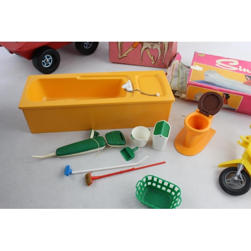 145 - A collection of vintage Sindy accessories to include buggy, moped, bath etc.