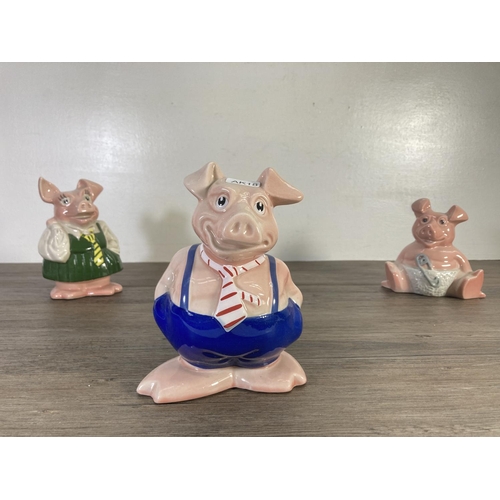 73 - Three ceramic pig money boxes, two Wade Natwest and one unstamped