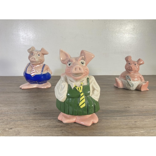 73 - Three ceramic pig money boxes, two Wade Natwest and one unstamped