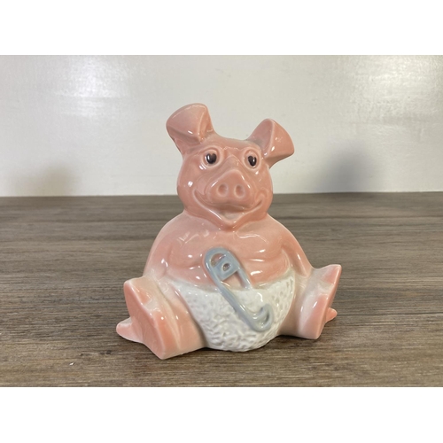 73 - Three ceramic pig money boxes, two Wade Natwest and one unstamped