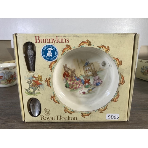 74 - Four boxed Royal Doulton Bunnykins items, two money balls, one hug-a-mug and one baby plate and feed... 