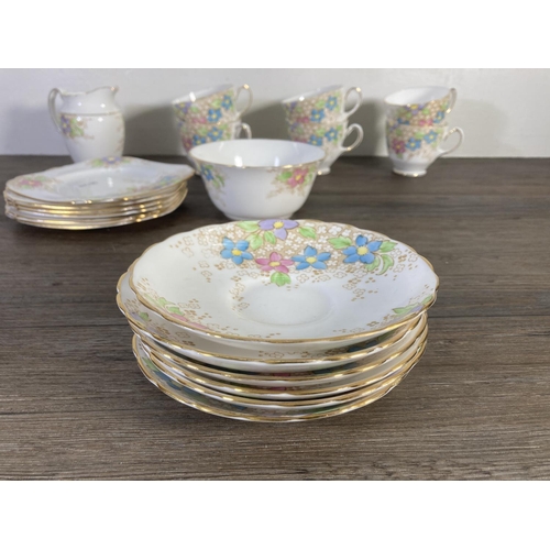 75 - A late 1930s Tuscan China hand painted floral pattern tea set comprising six cups, six saucers, six ... 