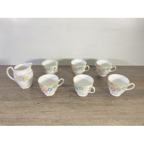 75 - A late 1930s Tuscan China hand painted floral pattern tea set comprising six cups, six saucers, six ... 