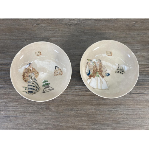 77A - Seven Oriental hand painted circular dishes with character marks to reverse - approx. 15cm in diamet... 