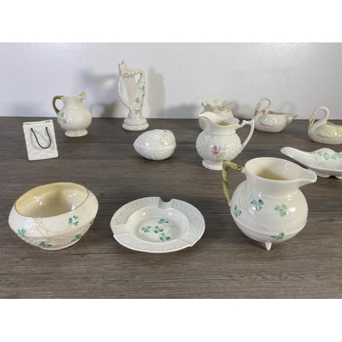 81 - Fifteen pieces of Belleek China to include ashtray, harp figurine, harp butter plate, egg shaped tri... 