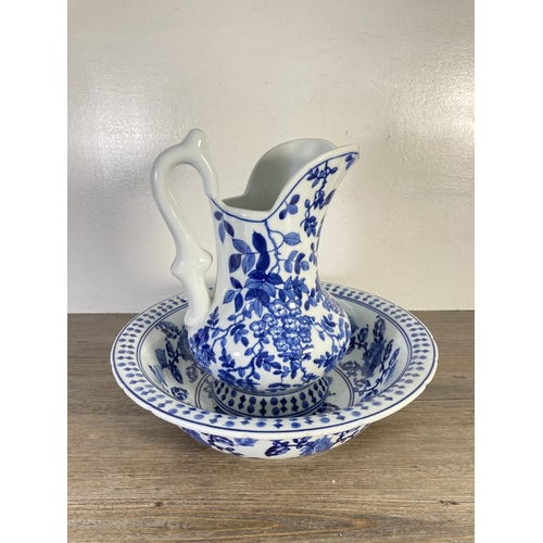 97 - Four pieces of blue and white china, Victoria Ironstone oversized cup and saucer with moustache guar... 