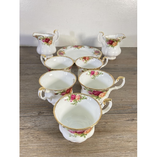 99 - Sixteen pieces of Royal Albert Old Country Roses china to include five cups, five saucers, two sugar... 