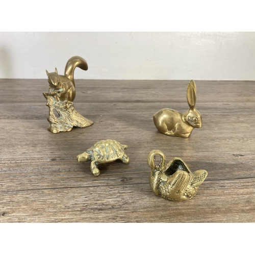 121 - Eleven pieces of brassware to include elephant figurine, bell with wooden handle, leaf and bird dish... 