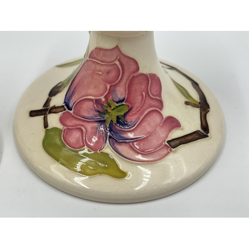 10 - A pair of Moorcroft Pottery Pink Magnolia pattern candlesticks - approx. 8.5cm high x 10cm diameter