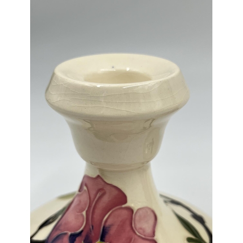 10 - A pair of Moorcroft Pottery Pink Magnolia pattern candlesticks - approx. 8.5cm high x 10cm diameter