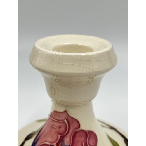 10 - A pair of Moorcroft Pottery Pink Magnolia pattern candlesticks - approx. 8.5cm high x 10cm diameter