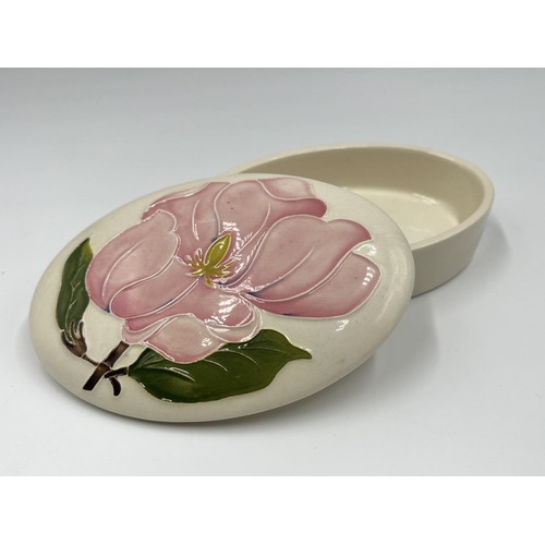 11 - A Moorcroft Pottery Pink Magnolia pattern oval lidded trinket box - approx. 3.5cm high x 9cm wide x ... 