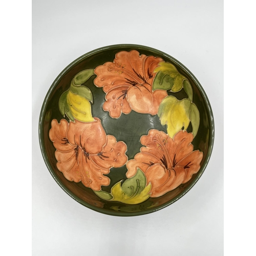 15 - A Moorcroft Pottery Coral Hibiscus pattern circular footed bowl, signed to base - approx. 7.5cm high... 