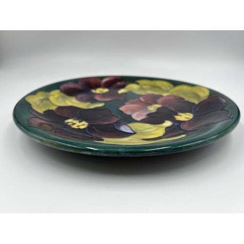 17 - A Moorcroft Pottery Clematis pattern plate - approx. 26cm diameter