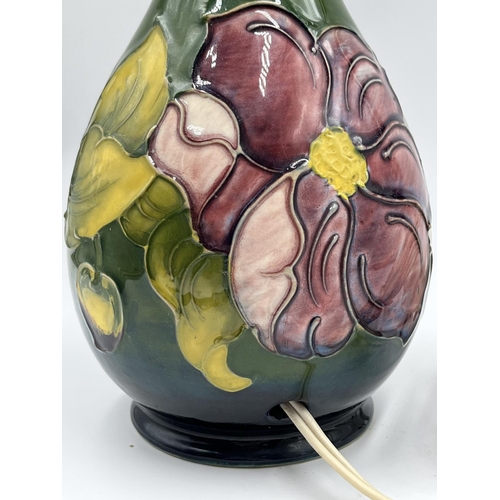 19 - A Moorcroft Pottery Clematis pattern table lamp - approx. 34cm high