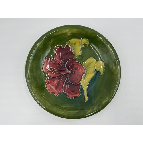 20 - A Moorcroft Pottery Hibiscus pattern circular dish - approx. 19cm diameter