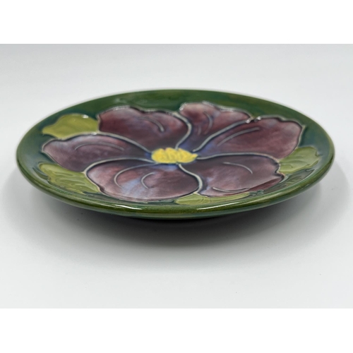 21 - A Moorcroft Pottery Clematis pattern circular trinket dish - approx. 11.5cm diameter