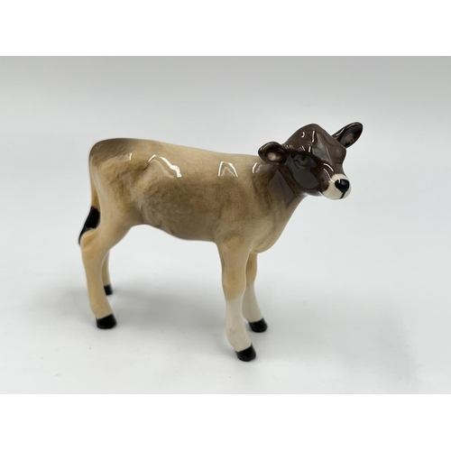 44 - Five Beswick animal figurines to include donkey, Solomon of Wendover golden labrador, deer etc.