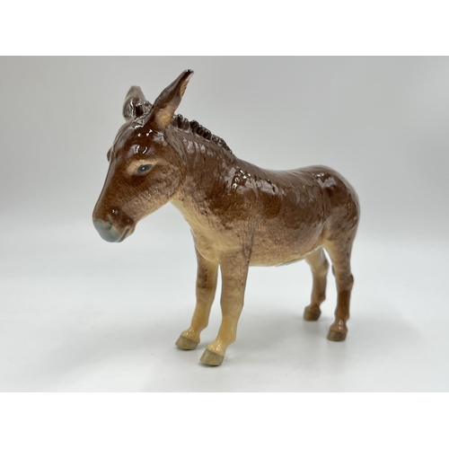 44 - Five Beswick animal figurines to include donkey, Solomon of Wendover golden labrador, deer etc.