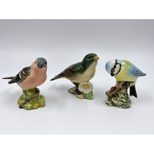 45 - Five Beswick bird figurines to include two owls, blue tit etc.