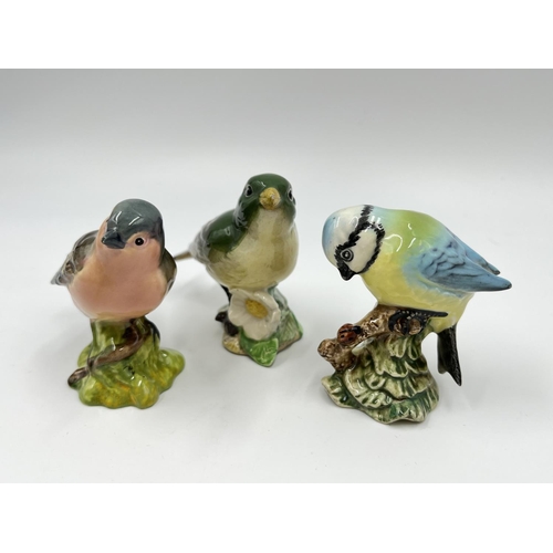 45 - Five Beswick bird figurines to include two owls, blue tit etc.