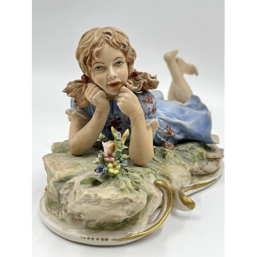 48 - Two Capodimonte figurines, one of a girl lying down signed Sandro Maggioni - approx. 12cm high x 23c... 