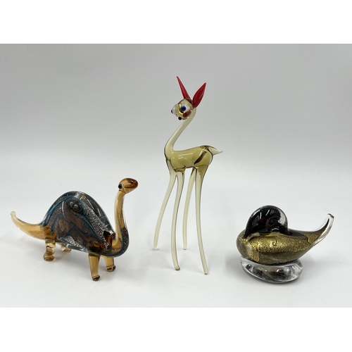 49 - Fourteen studio glass animal figurines to include penguin, frog, elephant etc.