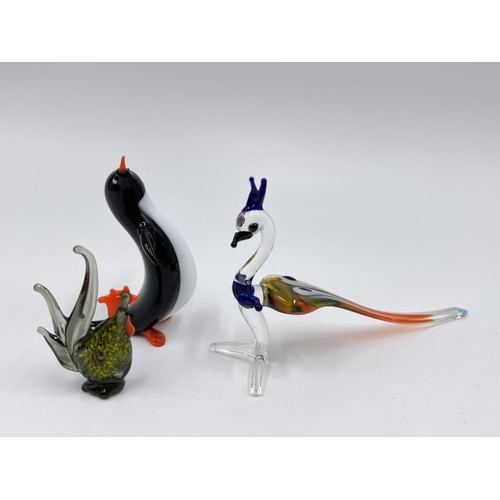 49 - Fourteen studio glass animal figurines to include penguin, frog, elephant etc.