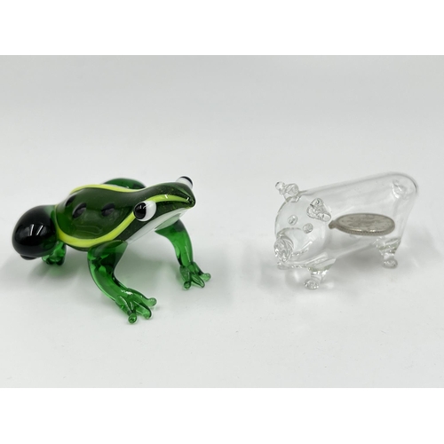 49 - Fourteen studio glass animal figurines to include penguin, frog, elephant etc.