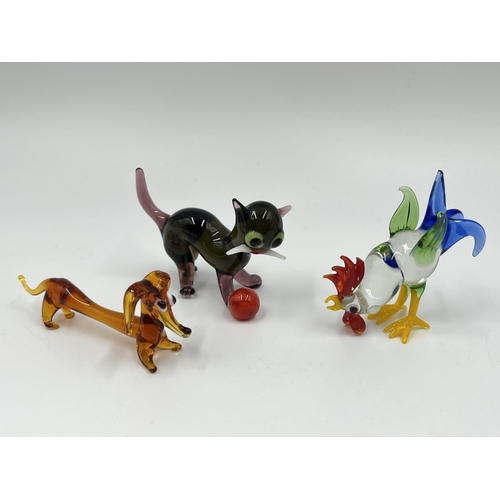 50 - Twelve studio glass animal figurines to include dog, cat, penguin etc.