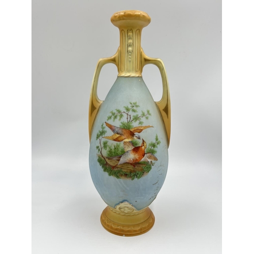 52 - A pair of late 19th/early 20th century Blush Ivory porcelain twin handled vases depicting bird scene... 